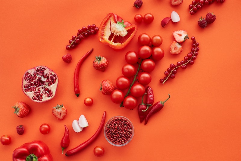 Photo composition of tomatoes, paprika, jalapenos, grenada, strawberries that originally are red, but seen as light green with protanopia