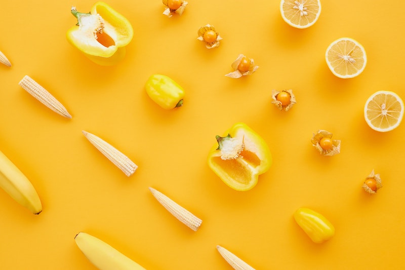 Photo composition of bananas, paprikas, lemons, mais that originally are yellow, but seen as bright yellow, almost neon yellow with protanopia